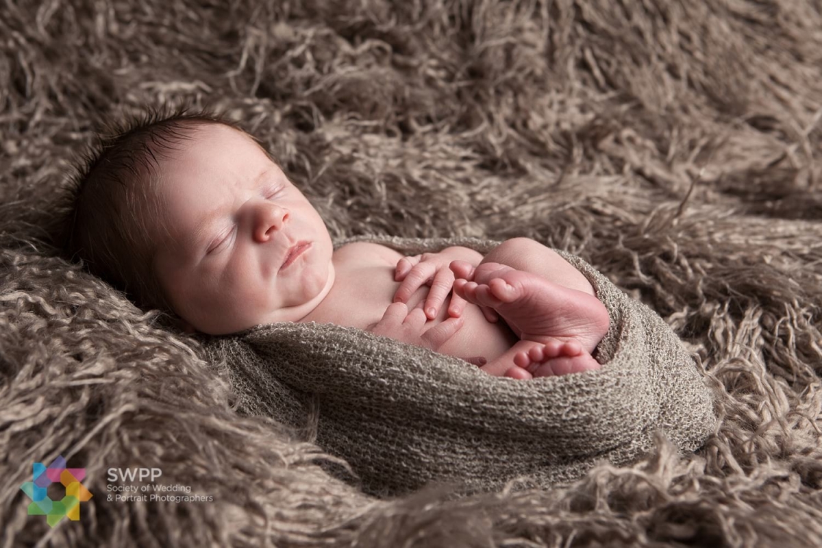 Highly commended award for newborn photograph of baby on a flokati blanket